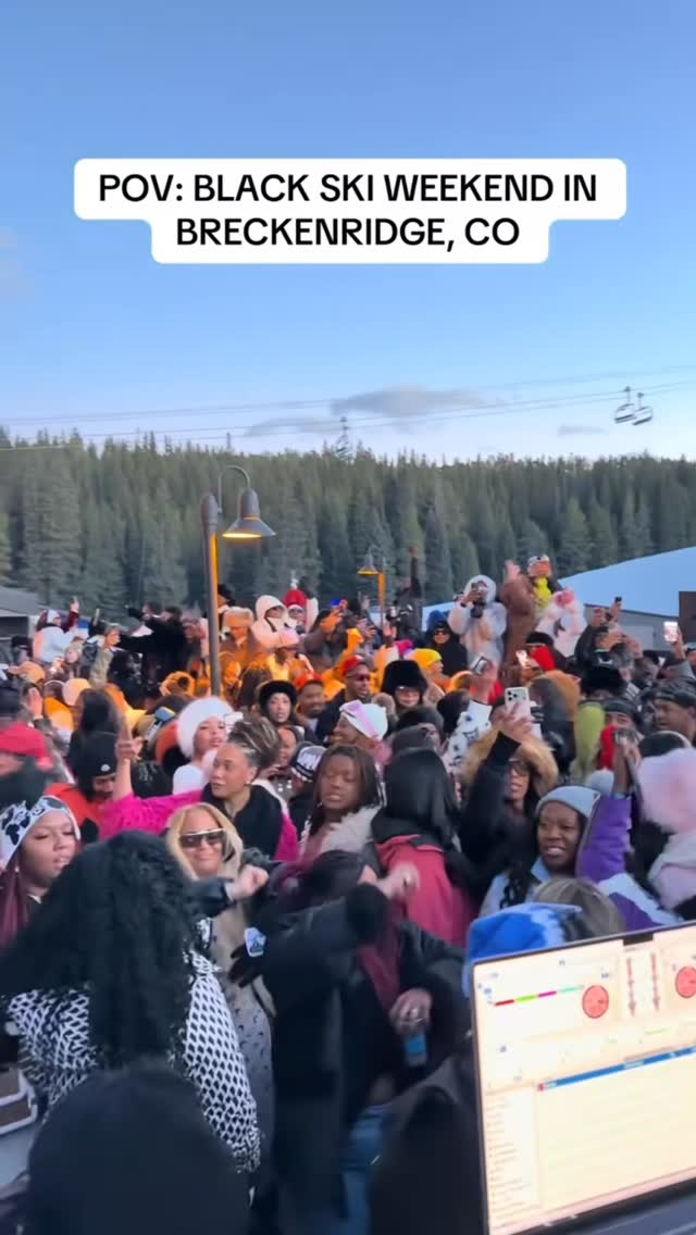 A packed Black Ski Weekend crowd dancing near DJ Kadero's booth in Breckenridge, Colorado
