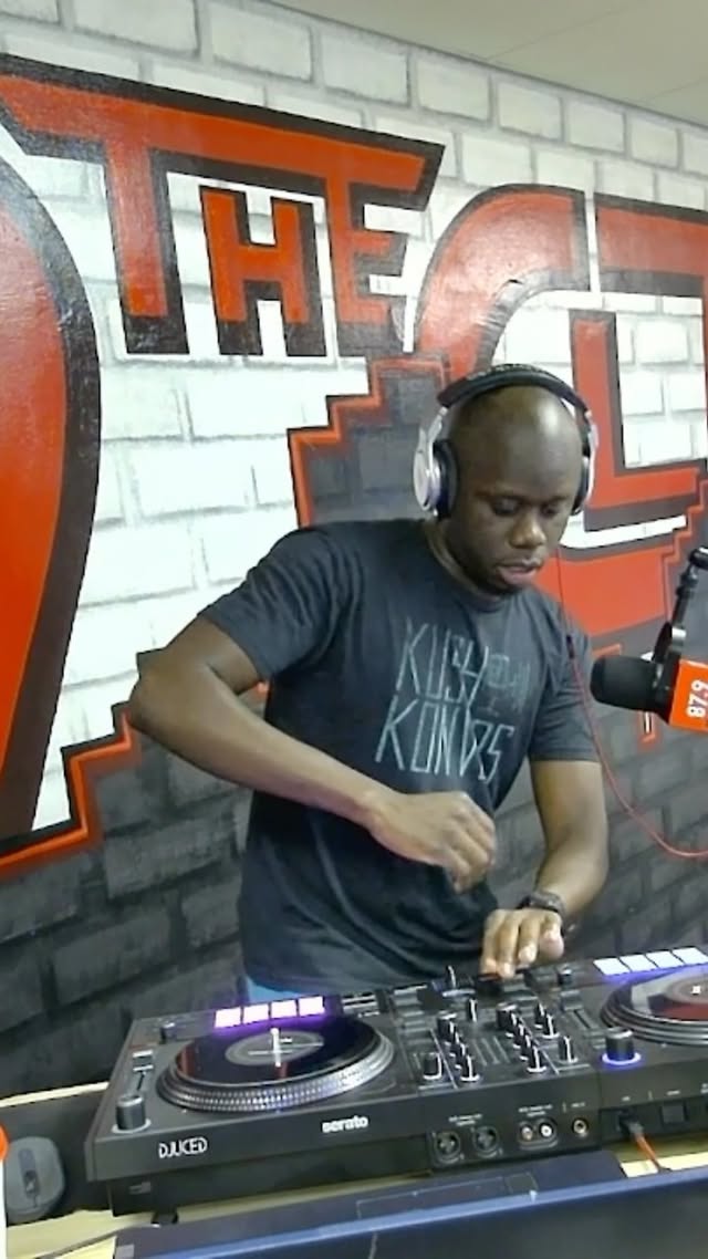 DJ Kadero performing on turntables during The Diaspora radio show at 87.9 The CLTR